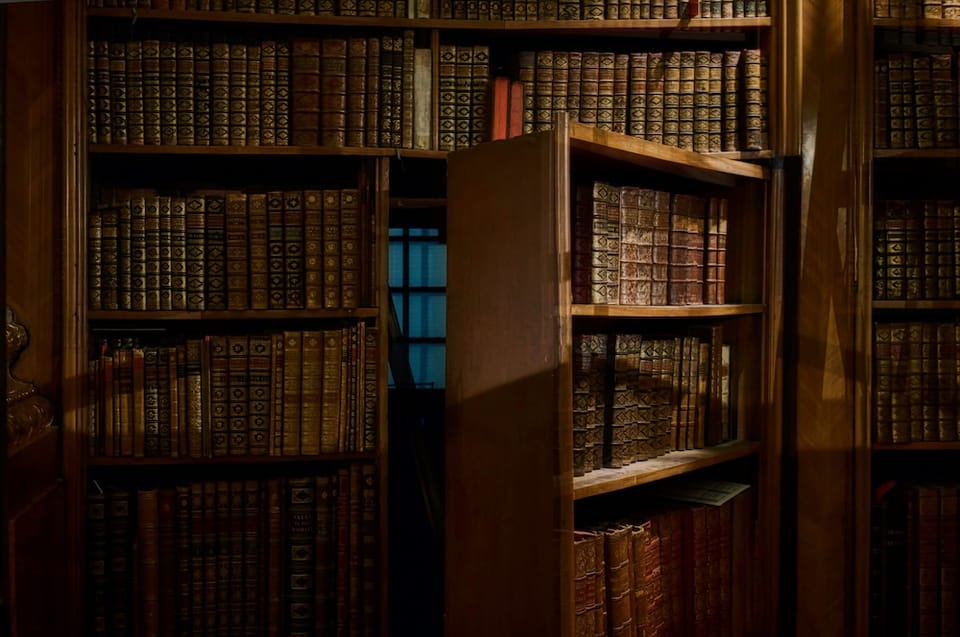 secret bookshelf door via unsplash